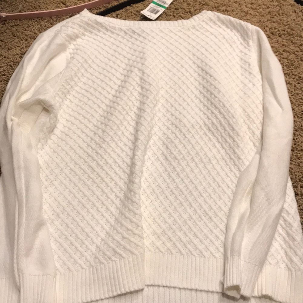 Women’s white sweater.